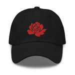 Load image into Gallery viewer, Make a statement year-round with our Roses Endure dad hat. Our beautiful, vibrant red embroidered rose stands out on our black and white cotton hats. Be strong, be resilient, and beautifully endure!
