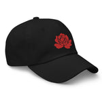 Load image into Gallery viewer, Make a statement year-round with our Roses Endure dad hat. Our beautiful, vibrant red embroidered rose stands out on our black and white cotton hats. Be strong, be resilient, and beautifully endure!
